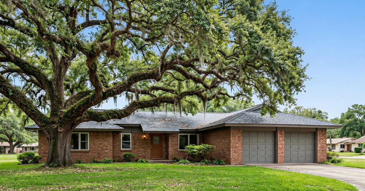 Burke Meadows roof repair in Pasadena: brick ranch with slate-gray dimensional shingles, attached garage and front yard oak, clear blue sky