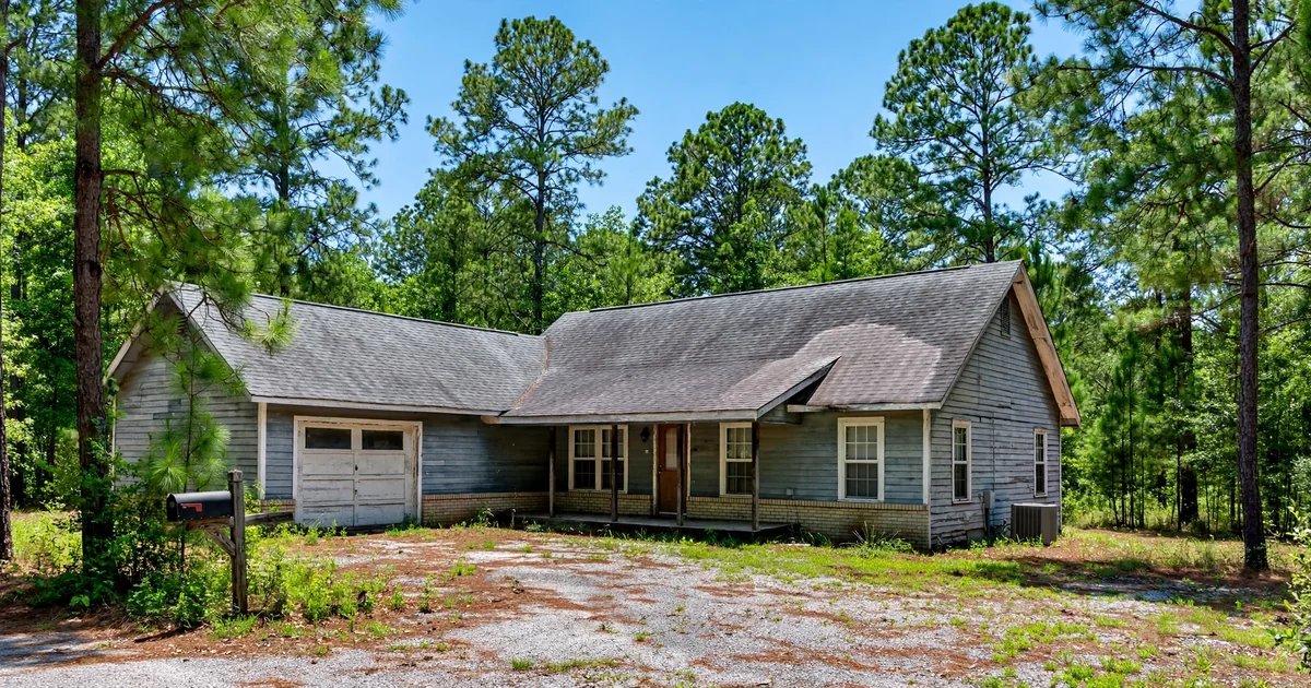 Teaswood roof repair in Conroe: suburban home with architectural shingle roof